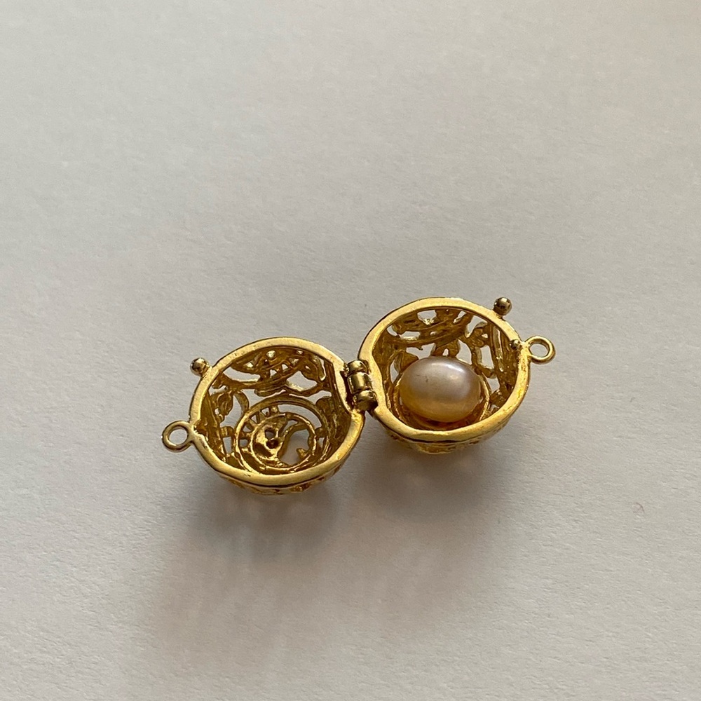 Real Pearl inside ornate globe locket